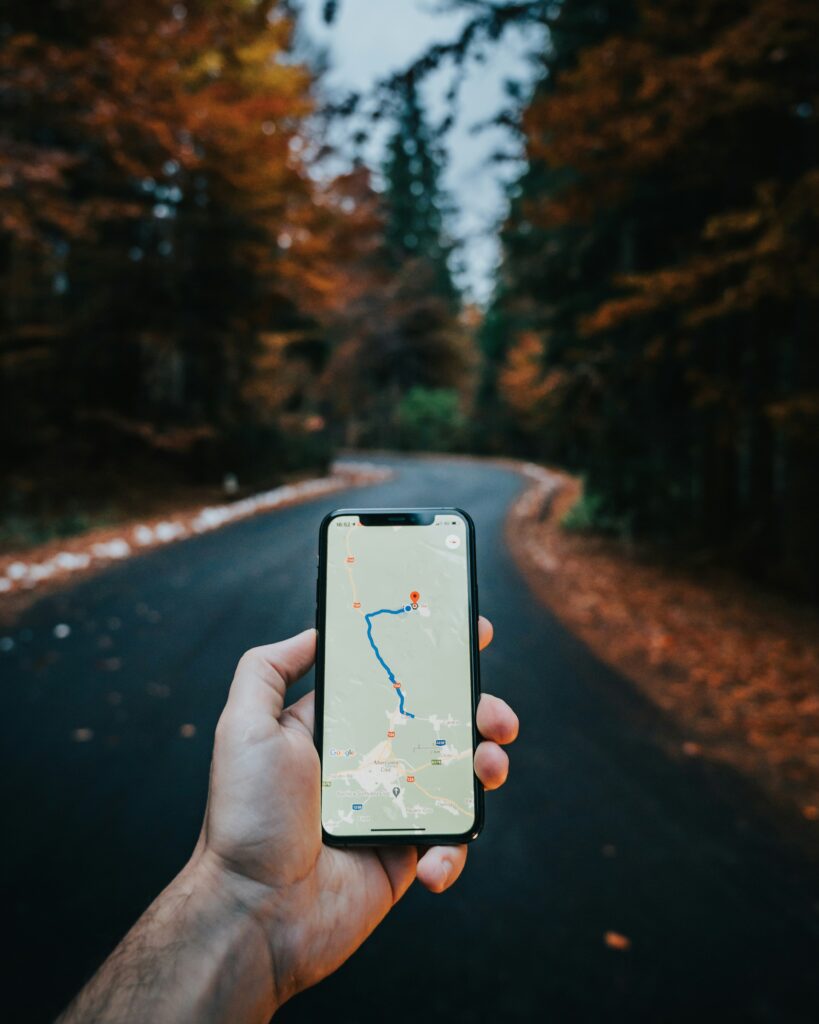 Map application on a phone to locate a Laurentians municipality in autumn