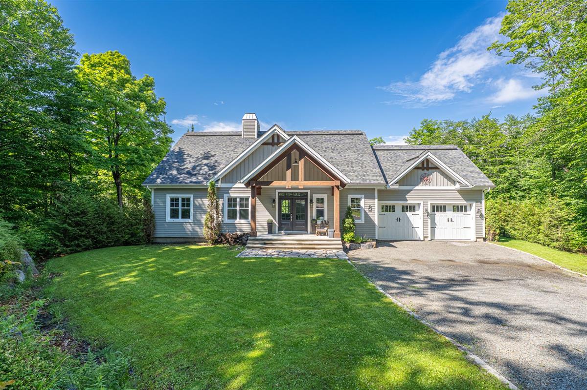 Single-family home for sale in a residential neighborhood in the Laurentians